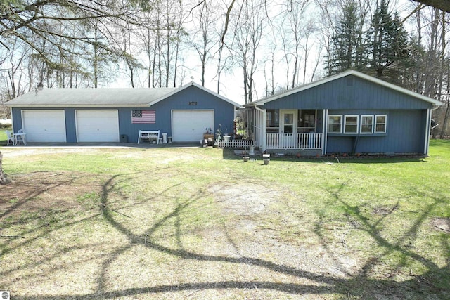1078 Duquesa Dr, Weidman, MI 48893 - single story home with a front lawn, a detached garage, and covered porch