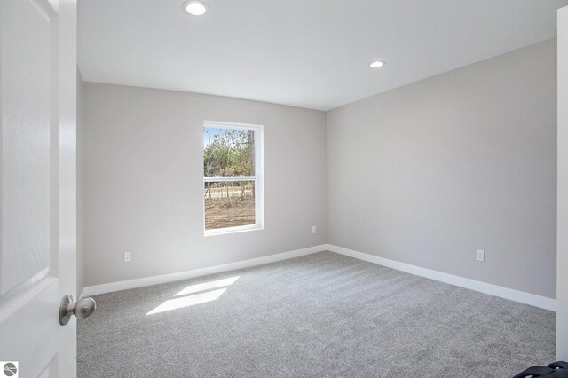 5203 NE Myers Rd, Kalkaska, MI 49646 - carpeted empty room featuring baseboards and recessed lighting