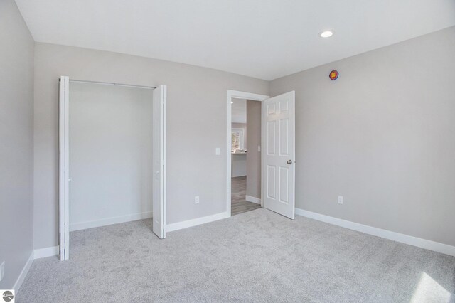 5203 NE Myers Rd, Kalkaska, MI 49646 - unfurnished bedroom featuring carpet, baseboards, recessed lighting, and a closet