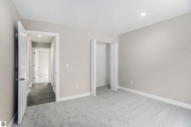 5203 NE Myers Rd, Kalkaska, MI 49646 - unfurnished bedroom featuring carpet floors, baseboards, recessed lighting, and a closet
