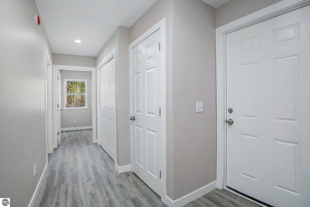 5203 NE Myers Rd, Kalkaska, MI 49646 - hall with baseboards, wood finished floors, and recessed lighting