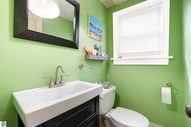 618 E Illinois St, Mount Pleasant, MI 48858 - half bathroom featuring toilet and vanity