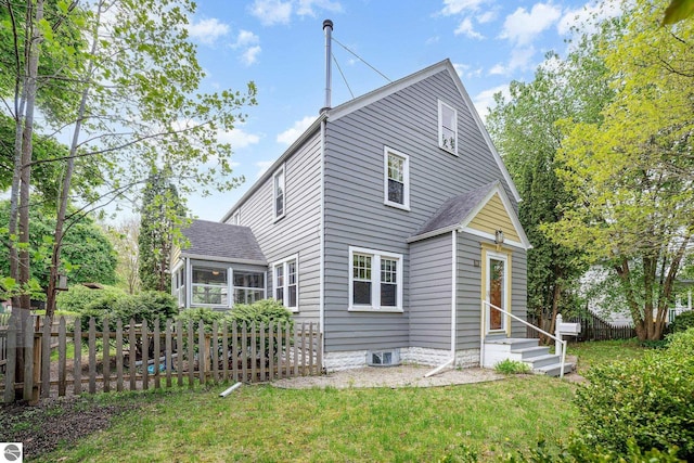 618 E Illinois St, Mount Pleasant, MI 48858 - rear view of house featuring entry steps and a sunroom