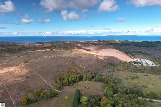aerial view of property and surrounding area with a nearby body of water