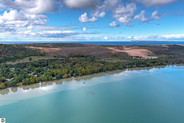 aerial view of a heavily wooded area and a large body of water