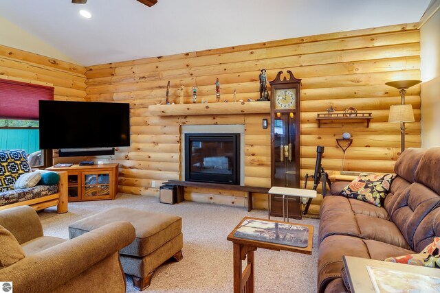 carpeted living area with log walls and lofted ceiling