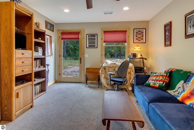 carpeted living room featuring a ceiling fan and recessed lighting