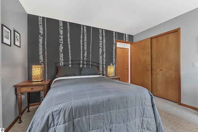 224 Island View Dr, Traverse City, MI 49696 - bedroom with carpet floors, baseboards, and a closet