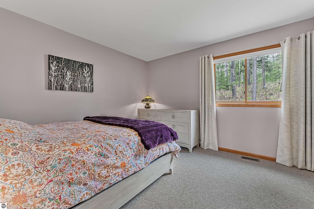 224 Island View Dr, Traverse City, MI 49696 - bedroom featuring carpet flooring and baseboards