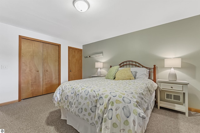 224 Island View Dr, Traverse City, MI 49696 - carpeted bedroom featuring two closets and baseboards