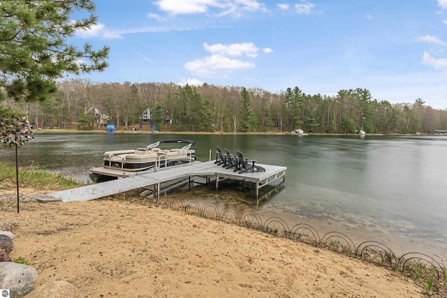 224 Island View Dr, Traverse City, MI 49696 - dock area featuring a view of trees and a water view