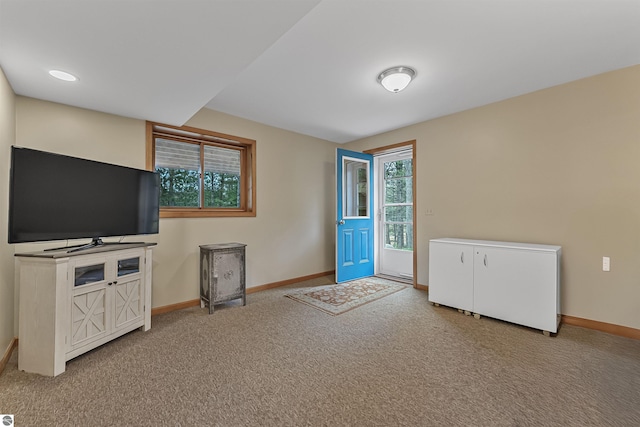 224 Island View Dr, Traverse City, MI 49696 - unfurnished living room with carpet and baseboards