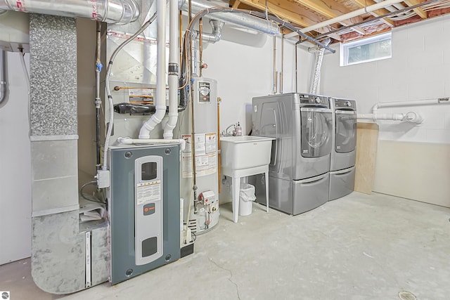 224 Island View Dr, Traverse City, MI 49696 - below grade area with independent washer and dryer and water heater