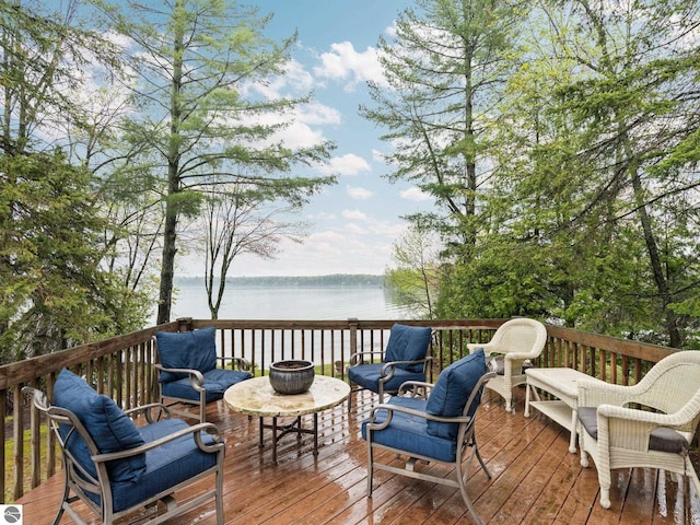 5467 Lakeview Dr, Interlochen, MI 49643 - wooden terrace with a water view and outdoor lounge area