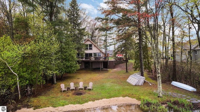 5467 Lakeview Dr, Interlochen, MI 49643 - view of green lawn with a deck