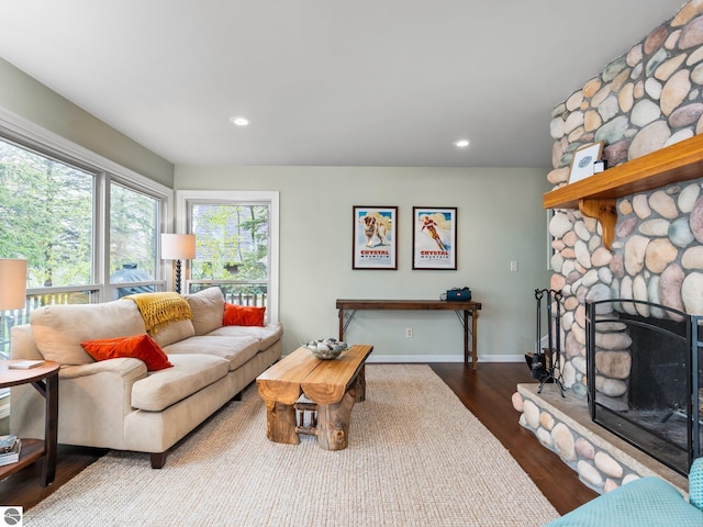 5467 Lakeview Dr, Interlochen, MI 49643 - living room with recessed lighting, wood finished floors, a stone fireplace, and baseboards