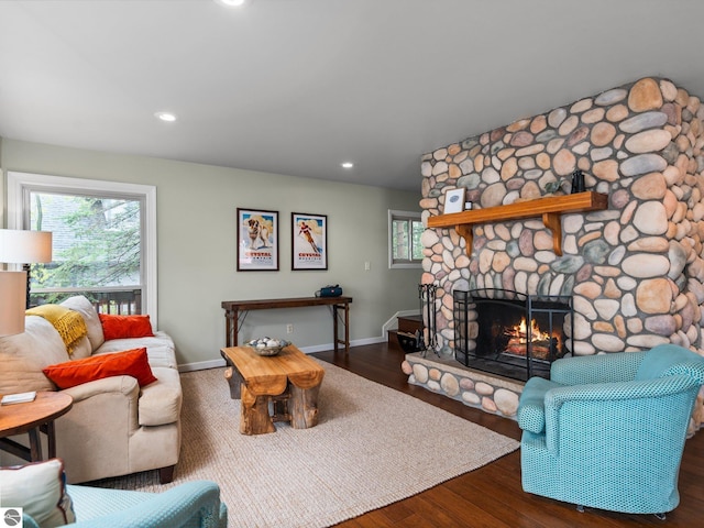 5467 Lakeview Dr, Interlochen, MI 49643 - living room featuring wood finished floors, a fireplace, baseboards, and recessed lighting