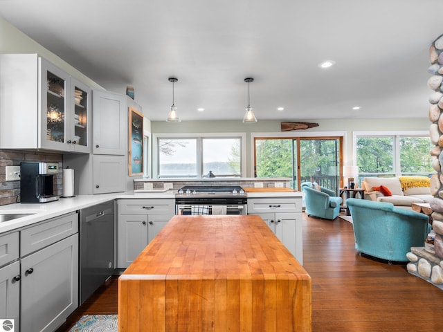 5467 Lakeview Dr, Interlochen, MI 49643 - kitchen with wooden counters, appliances with stainless steel finishes, open floor plan, healthy amount of natural light, and recessed lighting