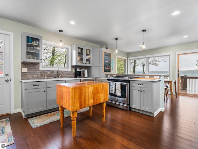 5467 Lakeview Dr, Interlochen, MI 49643 - kitchen with stainless steel range with electric cooktop, gray cabinets, light countertops, a sink, and recessed lighting