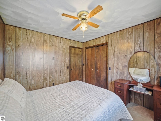 11401 Orchard Dr, Rapid City, MI 48622 - bedroom with wood walls, carpet floors, and a ceiling fan