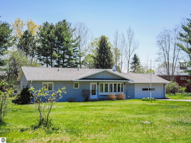 11401 Orchard Dr, Rapid City, MI 48622 - ranch-style house with an attached garage, a front lawn, and driveway