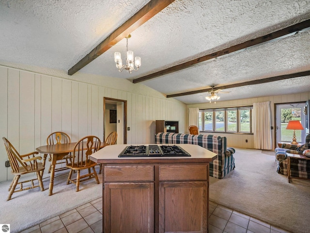 11401 Orchard Dr, Rapid City, MI 48622 - kitchen featuring black gas cooktop, a textured ceiling, light carpet, light tile patterned flooring, and open floor plan