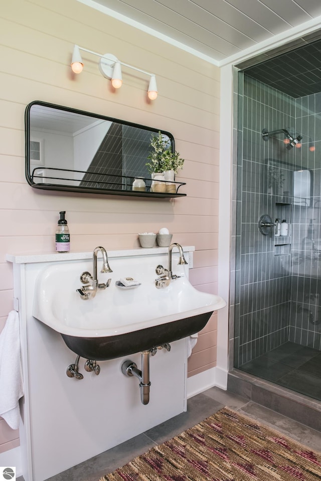 1435 S French Rd, Lake Leelanau, MI 49653 - full bath with wood walls, a stall shower, and a sink