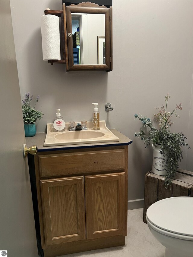 2324 S Main St, Central Lake, MI 49622 - half bathroom featuring vanity and toilet