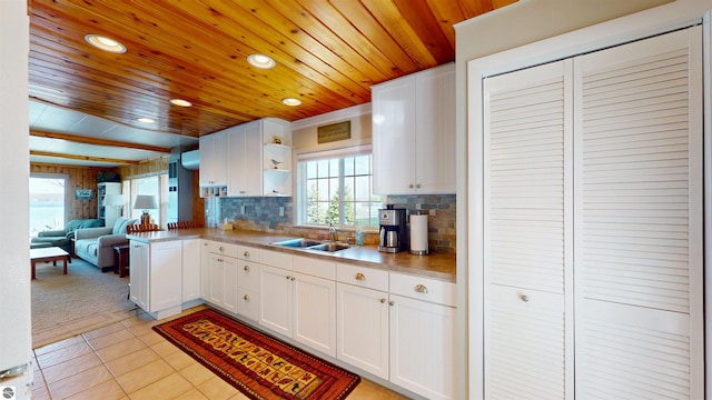 10701 SW Torch Lake Dr, Rapid City, MI 49676 - kitchen with a sink, wood ceiling, open shelves, recessed lighting, and white cabinetry