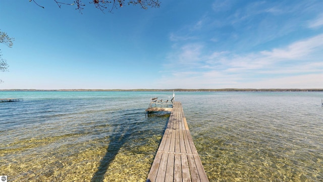 10701 SW Torch Lake Dr, Rapid City, MI 49676 - dock with a water view