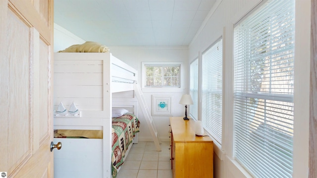 10701 SW Torch Lake Dr, Rapid City, MI 49676 - bedroom with light tile patterned floors