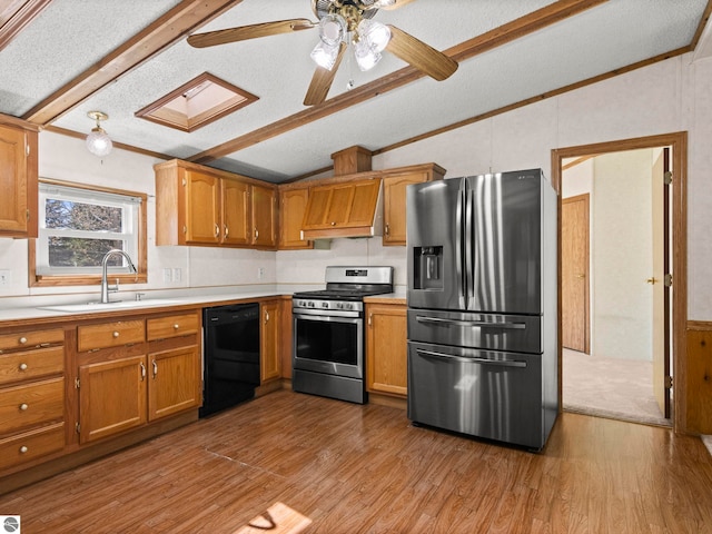 5891 N 19th Rd, Mesick, MI 49668 - kitchen with stainless steel appliances, premium range hood, light countertops, wood finished floors, and brown cabinetry
