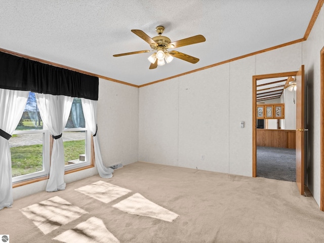 5891 N 19th Rd, Mesick, MI 49668 - unfurnished room with carpet, lofted ceiling, crown molding, a textured ceiling, and a ceiling fan
