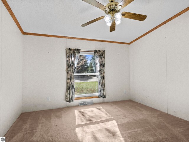 5891 N 19th Rd, Mesick, MI 49668 - carpeted empty room with crown molding and ceiling fan