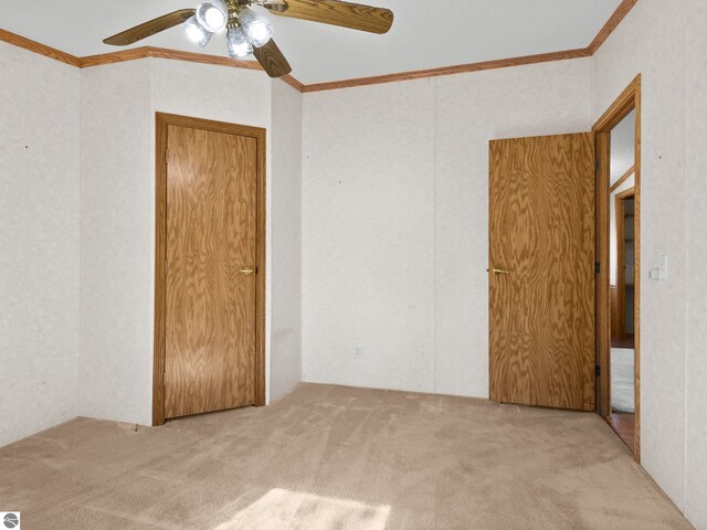 5891 N 19th Rd, Mesick, MI 49668 - unfurnished bedroom with carpet floors, ornamental molding, and a ceiling fan
