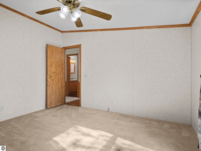 5891 N 19th Rd, Mesick, MI 49668 - empty room with carpet, crown molding, lofted ceiling, and ceiling fan