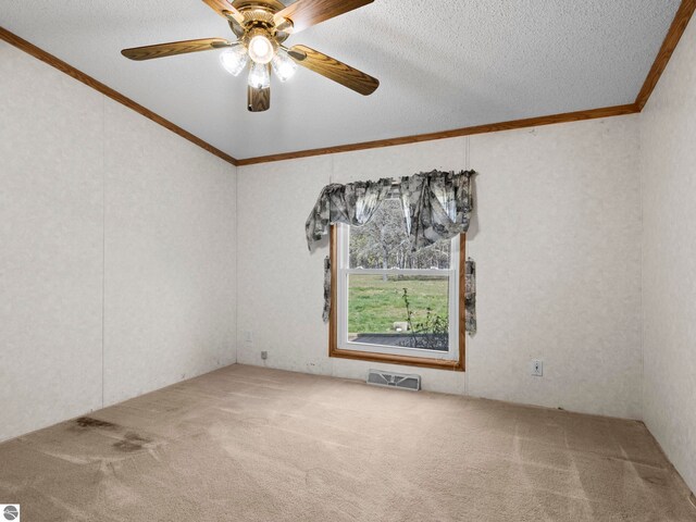 5891 N 19th Rd, Mesick, MI 49668 - carpeted empty room featuring crown molding, a ceiling fan, and a textured ceiling