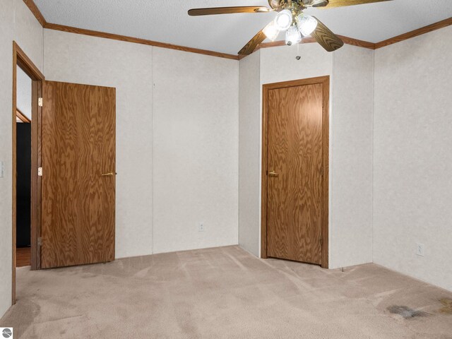 5891 N 19th Rd, Mesick, MI 49668 - carpeted spare room featuring ornamental molding and a ceiling fan