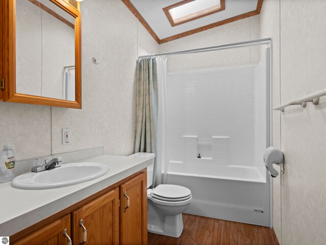 5891 N 19th Rd, Mesick, MI 49668 - bathroom featuring lofted ceiling, wood finished floors, vanity, toilet, and shower / bath combo