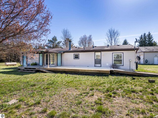 5891 N 19th Rd, Mesick, MI 49668 - back of property with a deck and a yard
