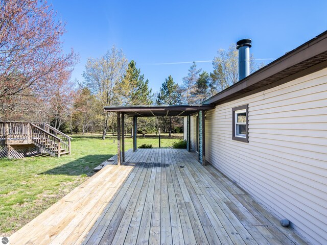 5891 N 19th Rd, Mesick, MI 49668 - deck featuring a lawn