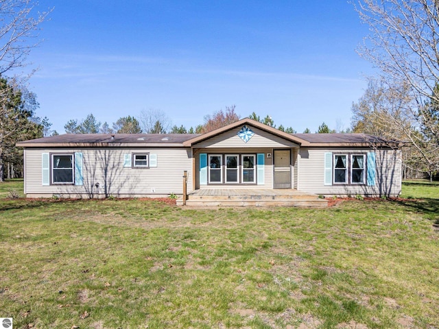 5891 N 19th Rd, Mesick, MI 49668 - rear view of property featuring a lawn and a porch