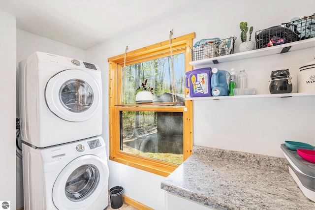 9266 Kenyon Trl, Frederic, MI 49733 - laundry area featuring stacked washer and clothes dryer