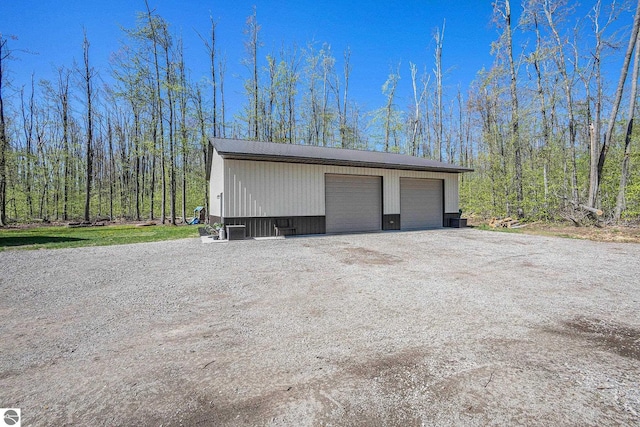 9266 Kenyon Trl, Frederic, MI 49733 - detached garage featuring cooling unit
