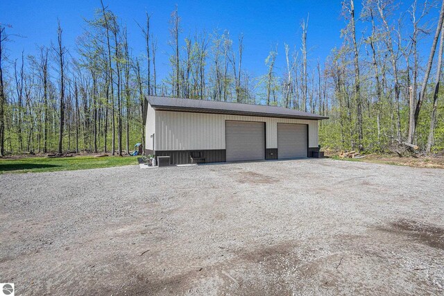 9266 Kenyon Trl, Frederic, MI 49733 - detached garage featuring cooling unit