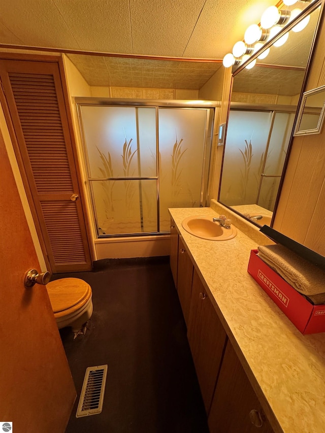 2737 County Road 633, Grawn, MI 49637 - bathroom with vanity, toilet, and a shower with door