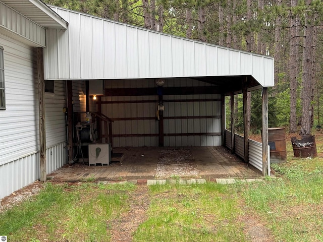 2737 County Road 633, Grawn, MI 49637 - garage with a carport