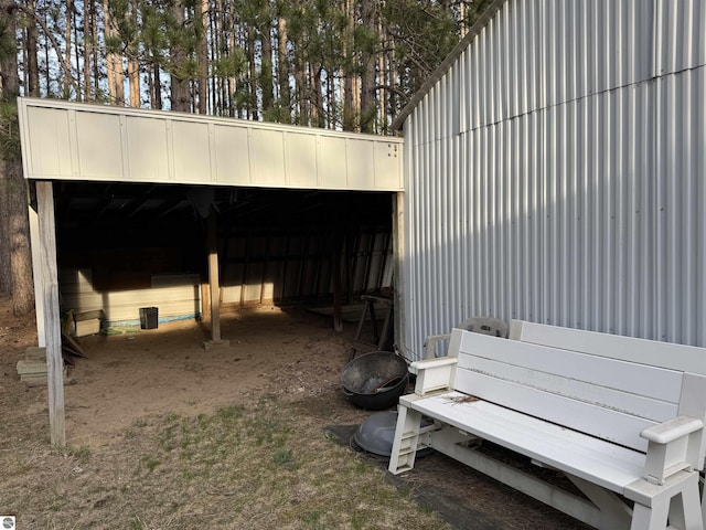 2737 County Road 633, Grawn, MI 49637 - view of pole building with a carport