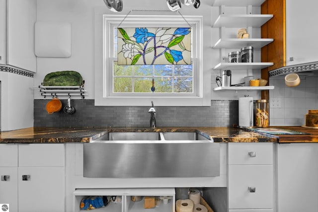 203 W 2nd St, Elk Rapids, MI 49629 - kitchen with open shelves, tasteful backsplash, and white cabinets