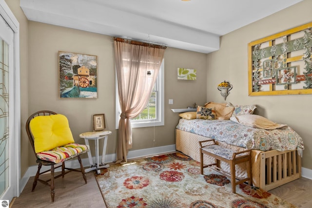 203 W 2nd St, Elk Rapids, MI 49629 - bedroom featuring wood finished floors and baseboards